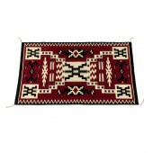 A NAVAJO STORM PATTERN RUG, 63