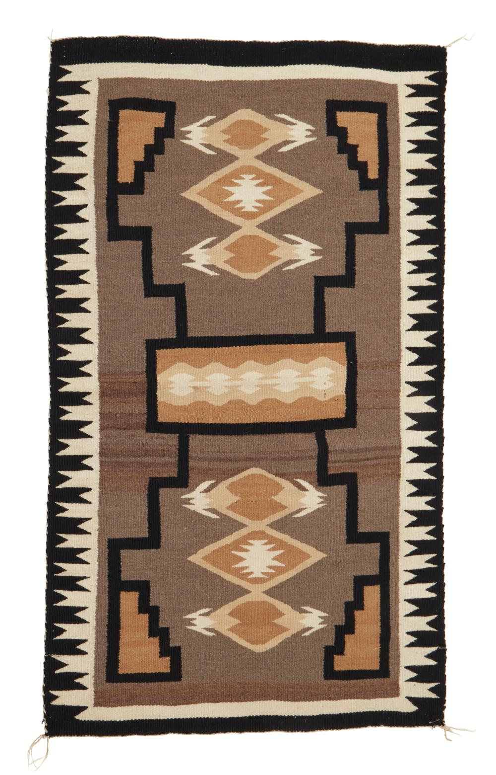 A NAVAJO STORM PATTERN VARIANT RUG;