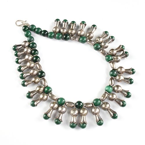 A NAVAJO STYLE TRIBAL SILVER AND