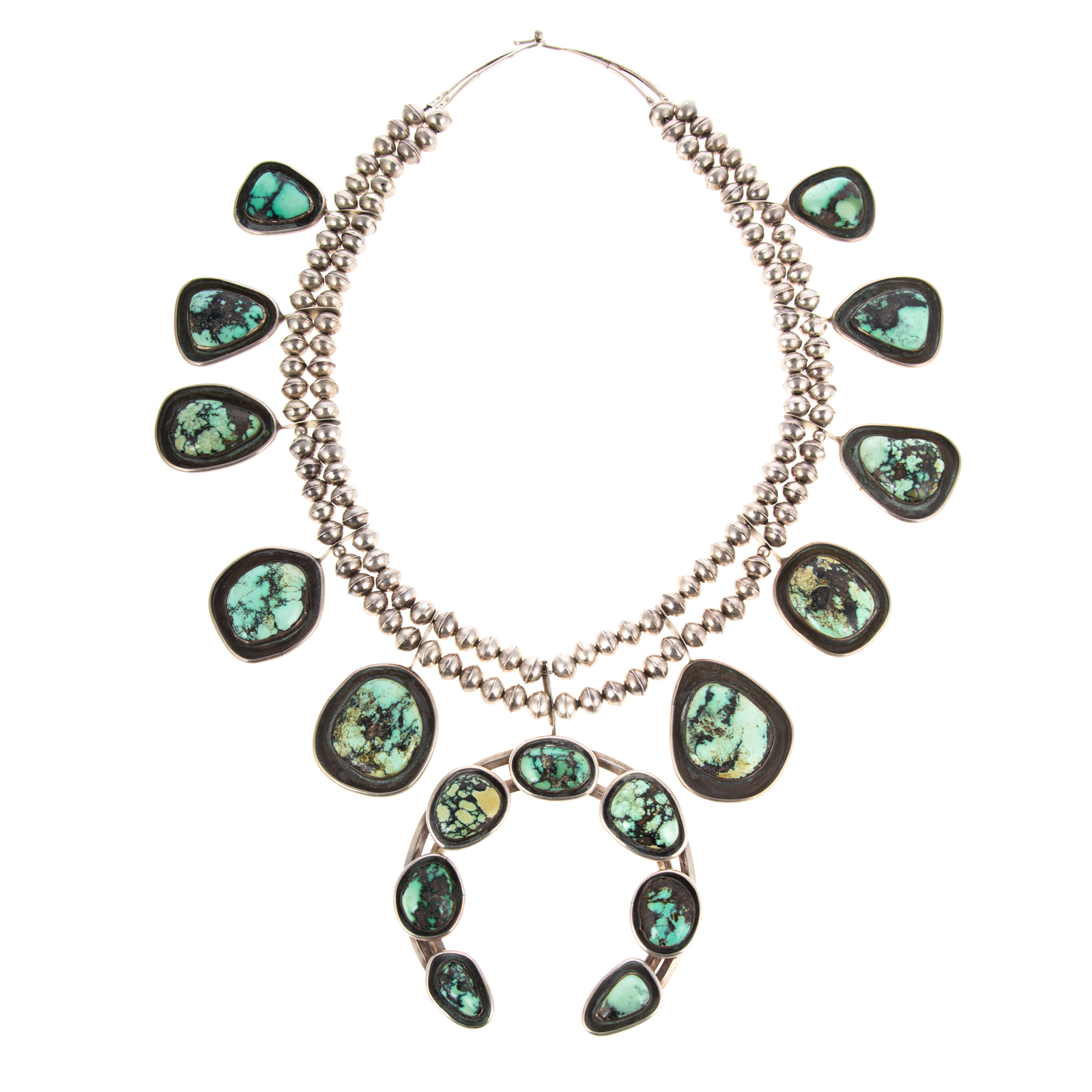 A NAVAJO TURQUOISE SQUASH BLOSSOM