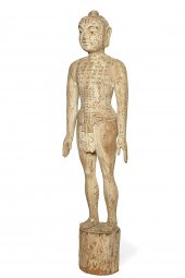 A NEAR LIFE SIZE ASIAN ACUPUNC