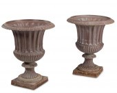 A NEAR-PAIR OF CAST IRON OUTDO