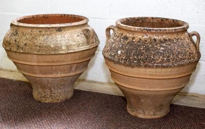 A near pair of Spanish terracotta