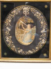 A needlework oval picture of a