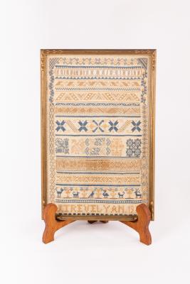 A needlework sampler with text