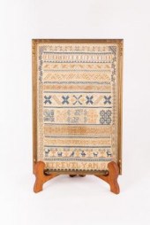 A needlework sampler with text