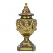 A NEOCLASSICAL GILT AND PATINA