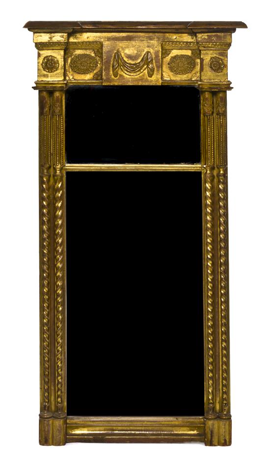 A Neoclassical Giltwood Mirror of