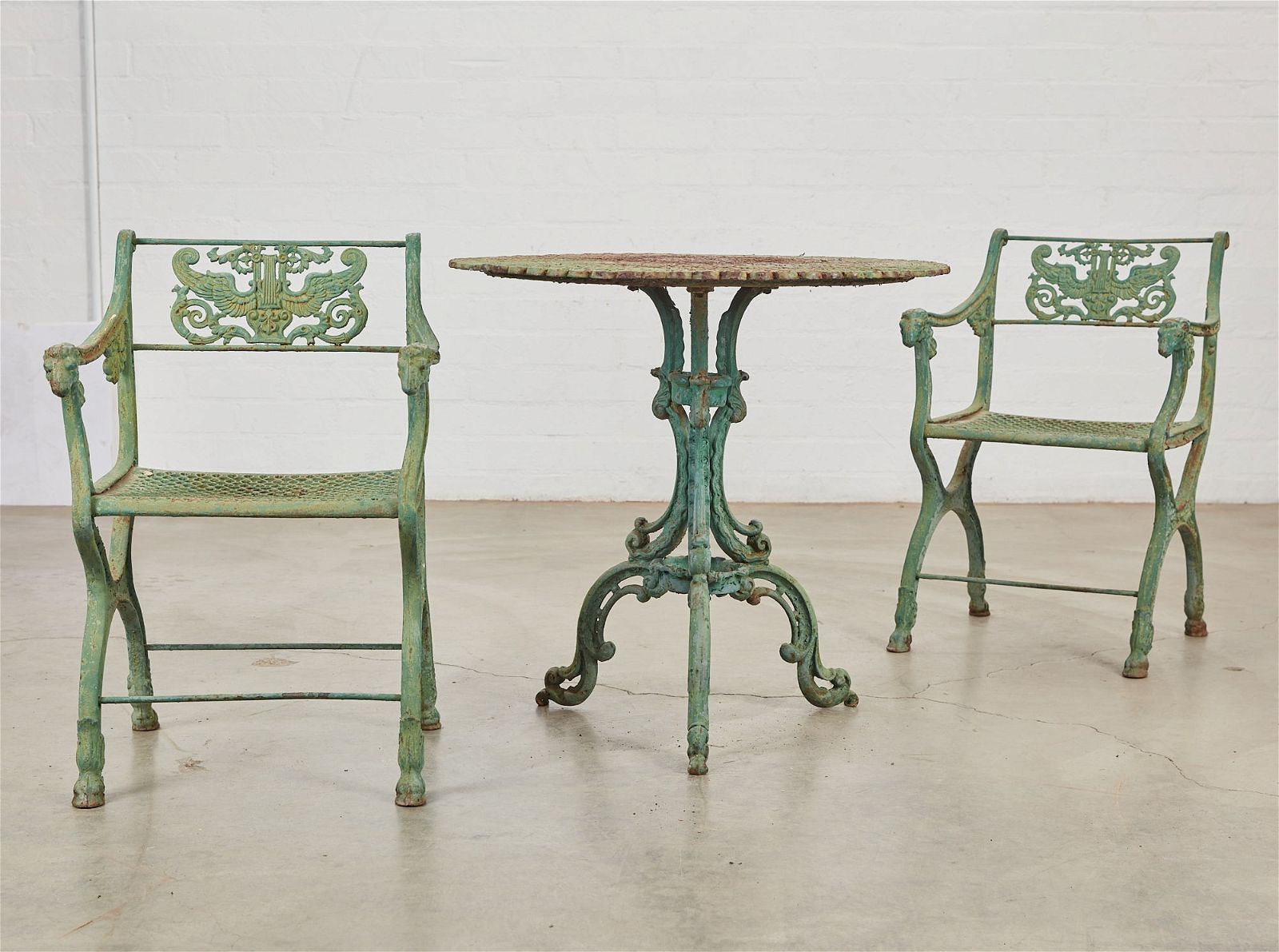 A NEOCLASSICAL STYLE IRON TABLE AND