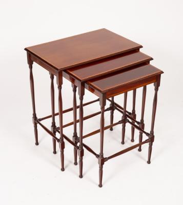 A nest of three mahogany tables,