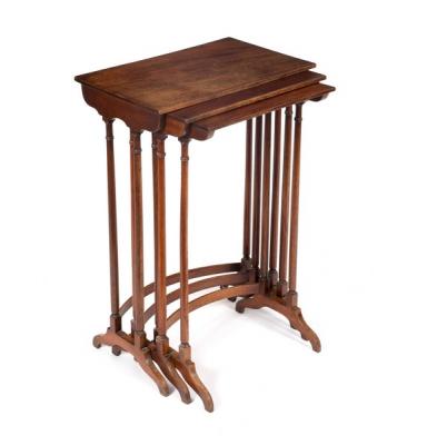 A nest of three mahogany tables