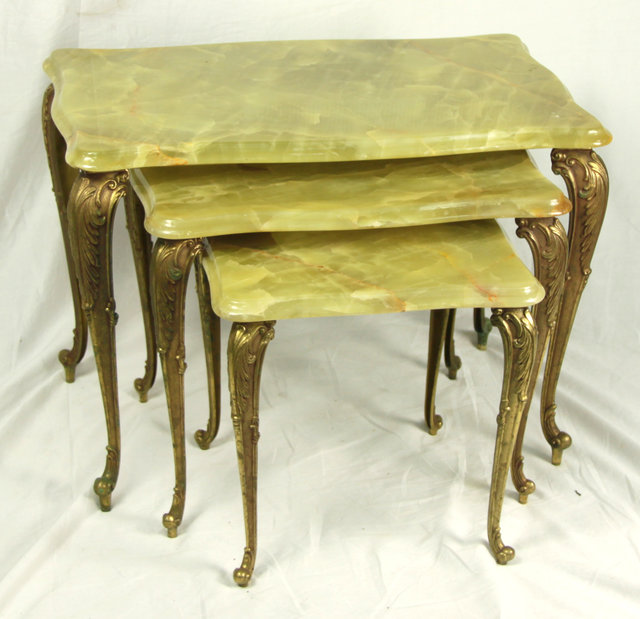 A nest of three onyx tables