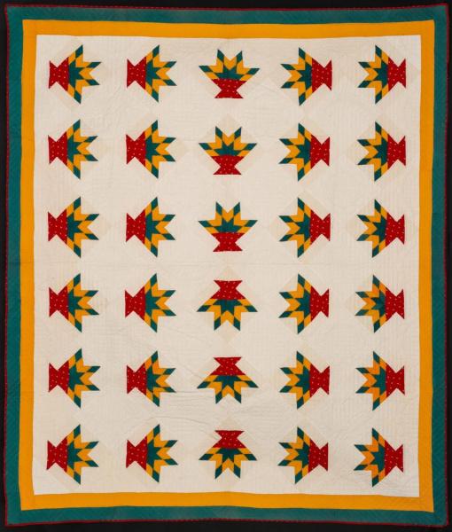 A NICELY QUILTED FLOWER BASKET
