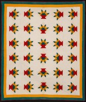 A NICELY QUILTED FLOWER BASKET