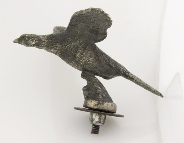 A nickel plated car mascot circa