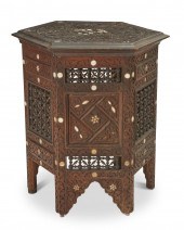 A NORTH AFRICAN CARVED WOOD SI