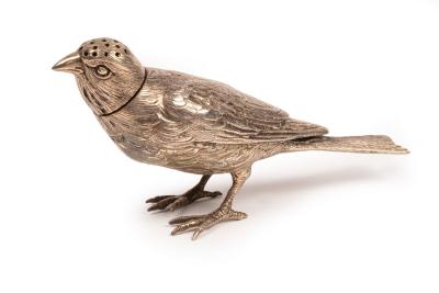 A novelty silver pepper pot of