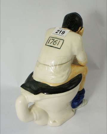A Novelty Teapot of a Man on Toilet