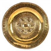A Nuremberg brass alms dish wi