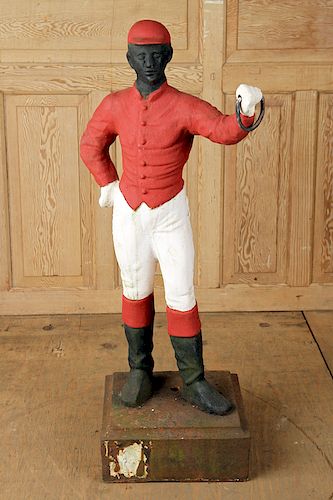 A PAINTED CAST IRON JOCKEY CIRCA