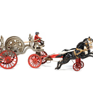 A Painted Cast-Iron Three-Horse Toy