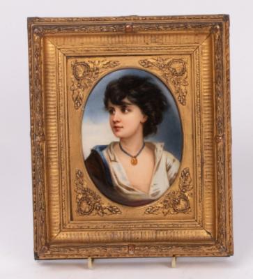 A painted oval plaque of a young