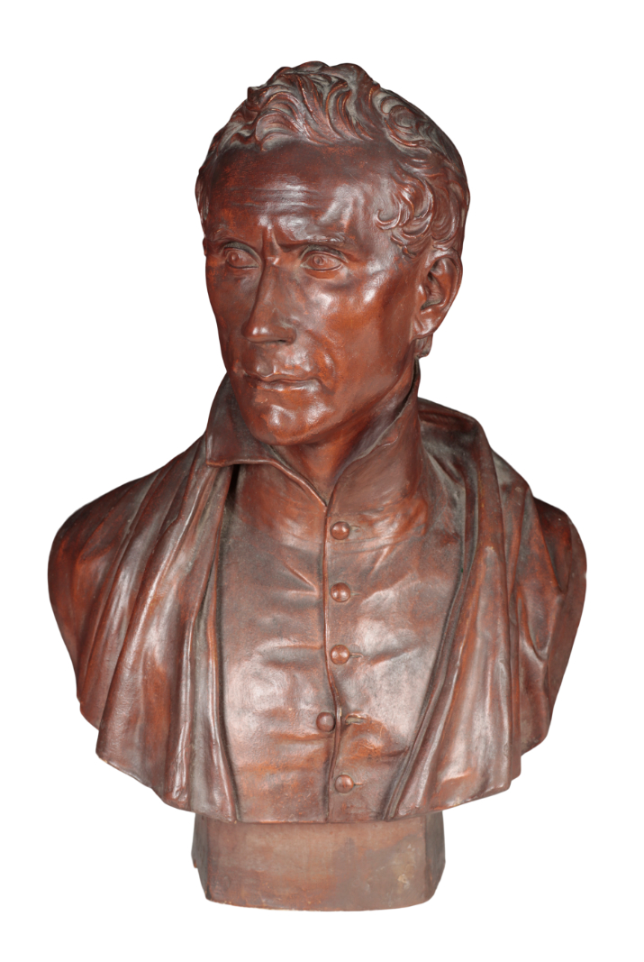 A PAINTED PLASTER BUST OF A