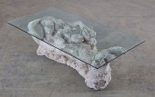A PAINTED STONE AND GLASS MERM
