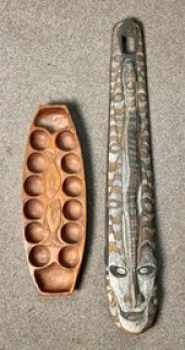 A painted wood mask with cowri