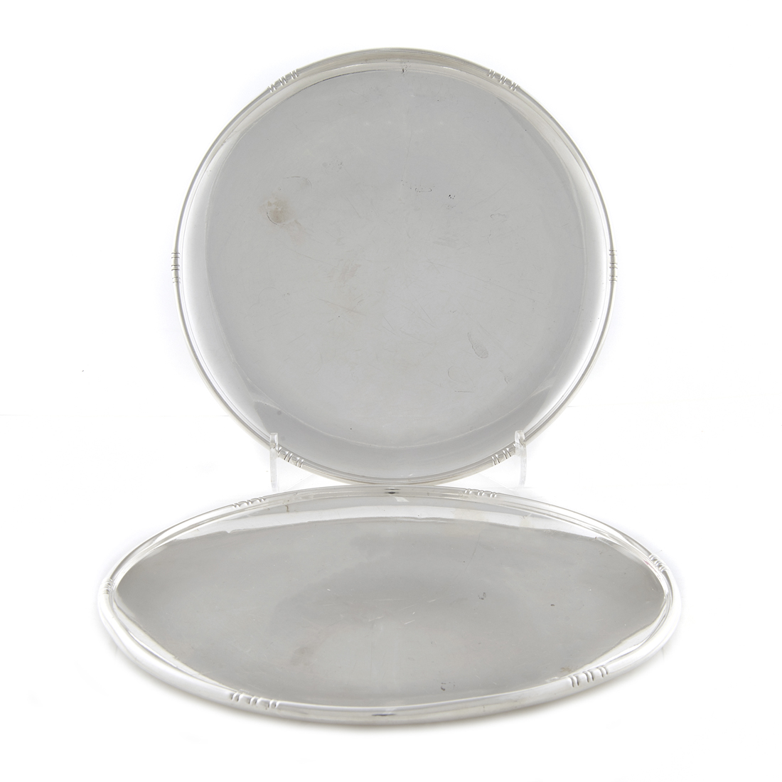 A PAIR MODERNIST STERLING ROUND