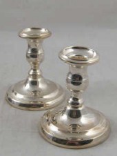A pair of 800 silver candlesti