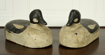A pair of antique carved and