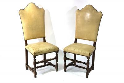 A pair of arch back chairs with