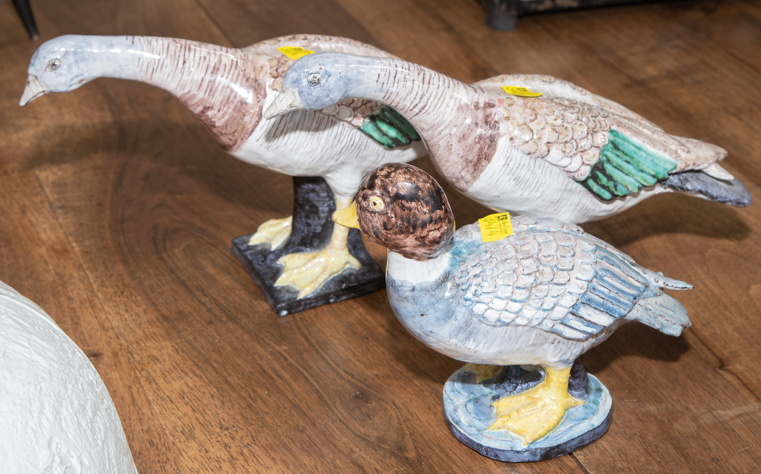 A PAIR OF ART POTTERY GEESE &