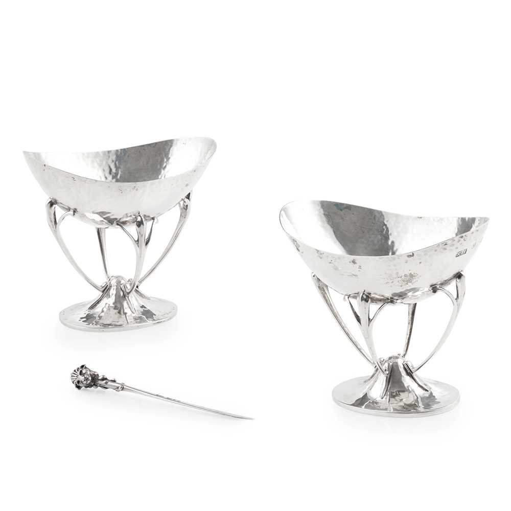 A PAIR OF ARTS AND CRAFT COMPORTS