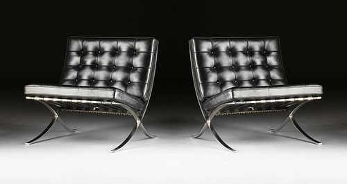 A PAIR OF BARCELONA CHAIRS IN BLACK