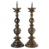 A PAIR OF BAROQUE BRONZE PRICK