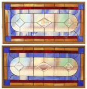A PAIR OF BEVELED AND STAINED