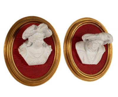 A pair of bisque porcelain wall