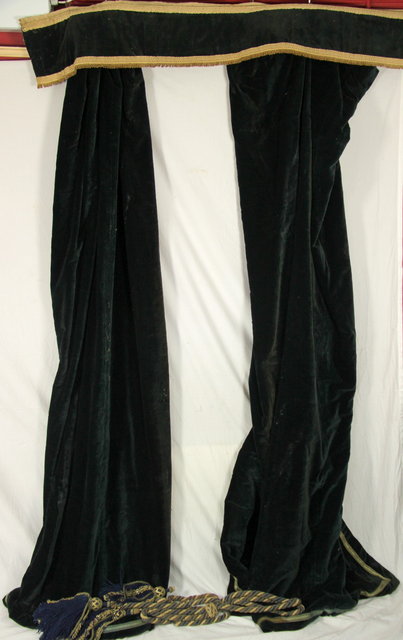 A pair of black velvet curtains