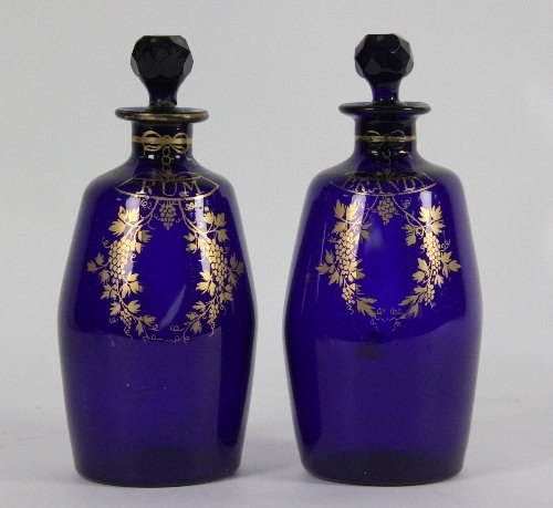 A pair of blue glass spirit
