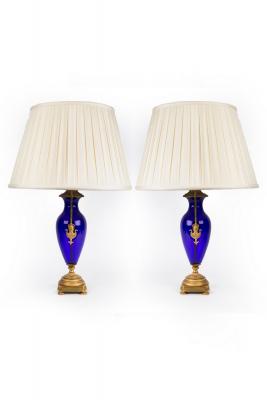 A pair of blue glass vase-shaped