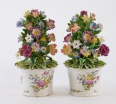 A PAIR OF BOW TUBS OF FLOWERS