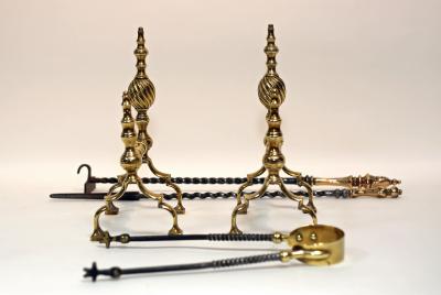 A pair of brass andirons and a