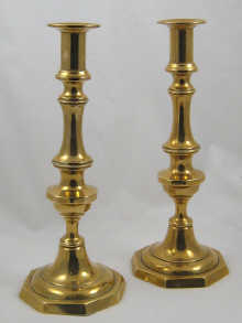 A pair of brass candlesticks with
