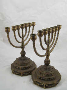 A pair of brass menorahs ht. 29 cm.