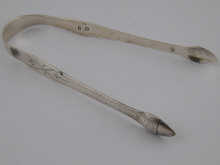 A pair of bright cut silver sugar