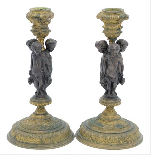 A PAIR OF BRONZE AND GILT BRONZE