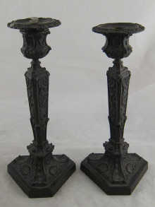 A pair of bronze candlesticks