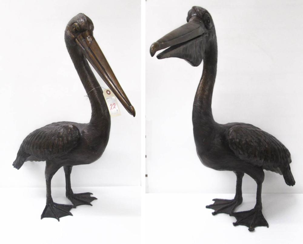A PAIR OF BRONZE PELICANS, MALE &